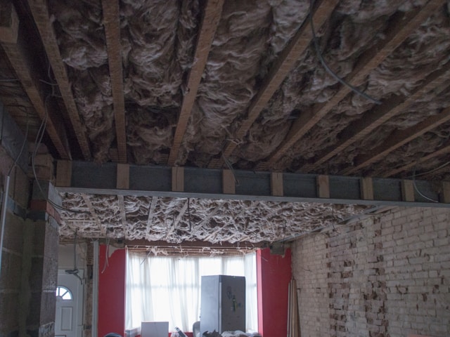 interior of building under construction with exposed ceiling beams